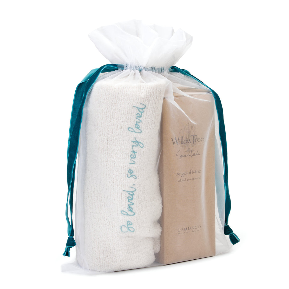 View of white towel in white see-through drawstring bag and willow tree brown box