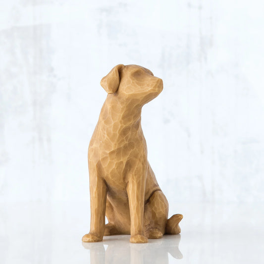 Golden dog sitting down figurine