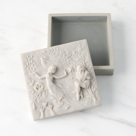White resin box with detached lid carved with figural and organic imagery; velvety gray-green finish in box base